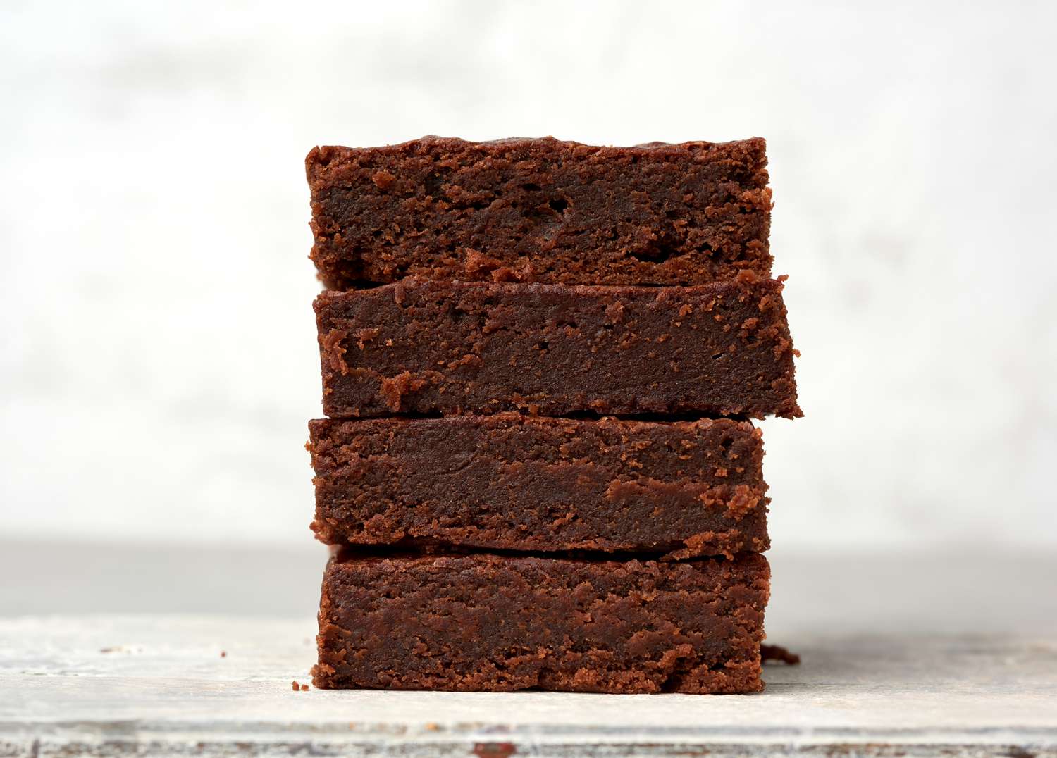 Side view of four brownies stacked on top of eachother