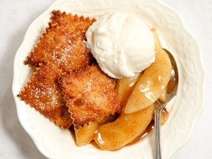 short-cut apple pie and a dollop of vanilla ice cream in a bowl with a spoon