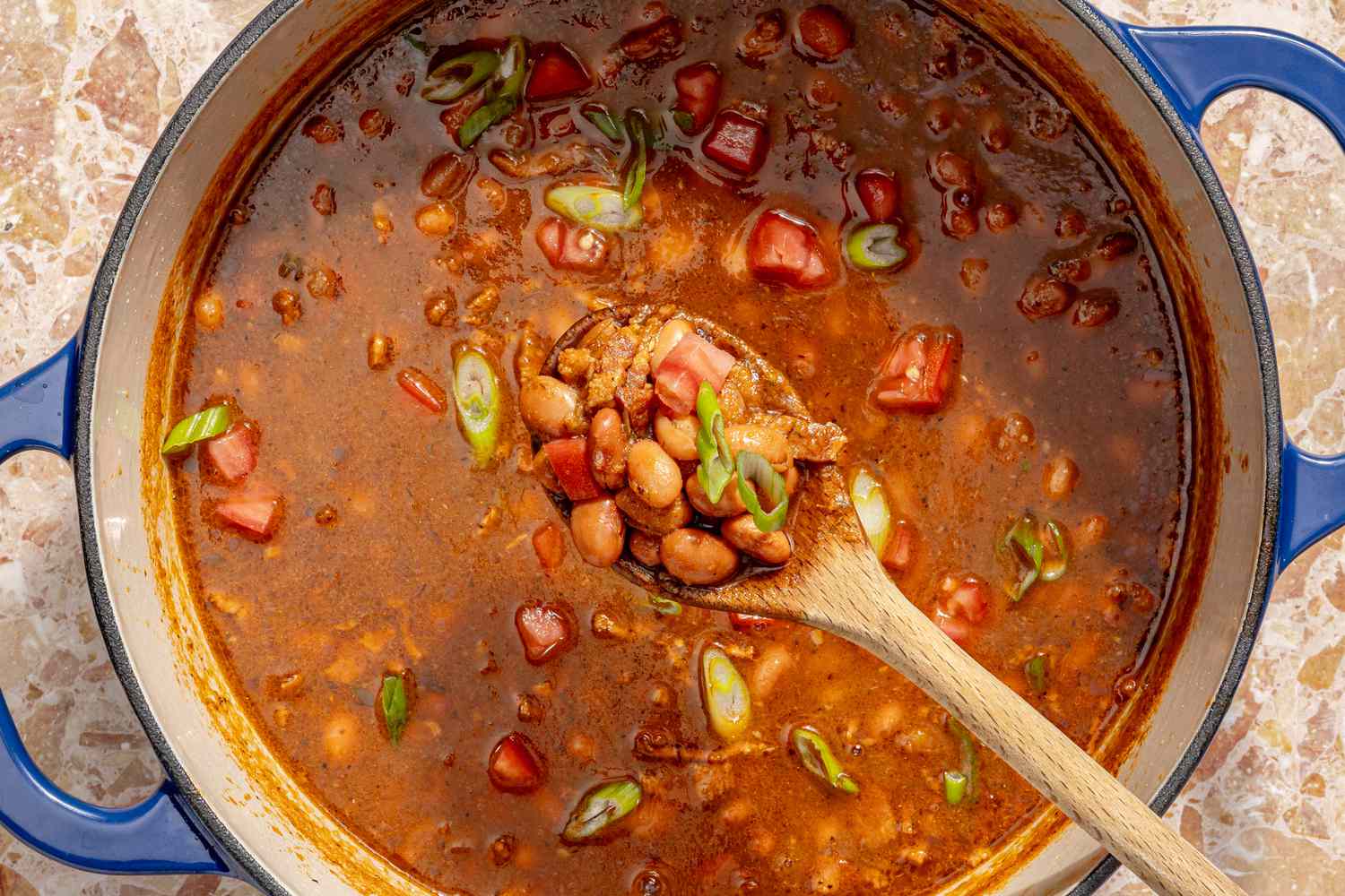overhead view of a large pot of chili with beans