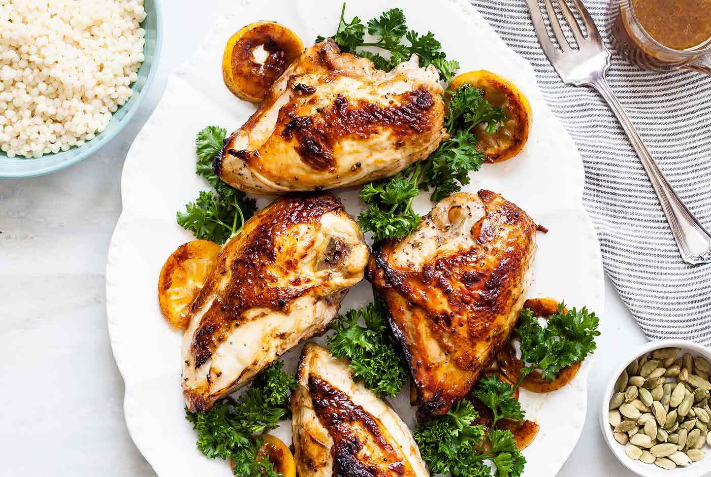 Cardamom Honey Baked Chicken Pieces on a plate with garnish