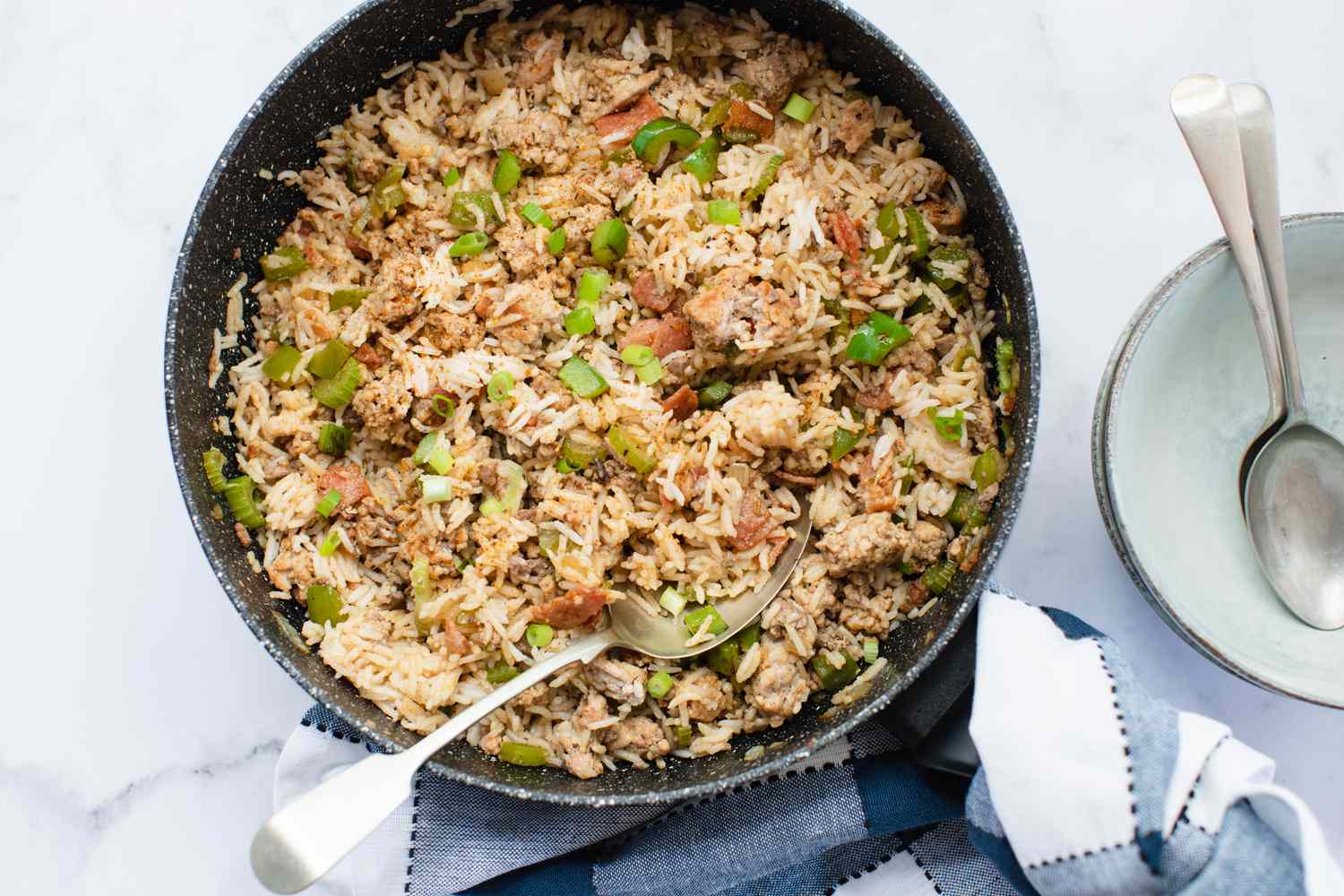 Overhead view of dirty rice in a skillet.