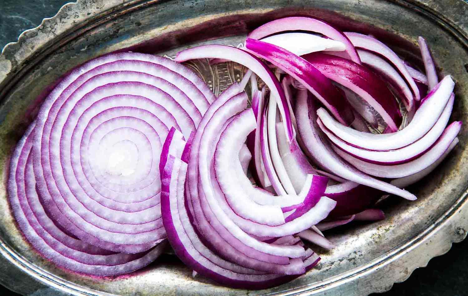 Sliced red onion on a platter