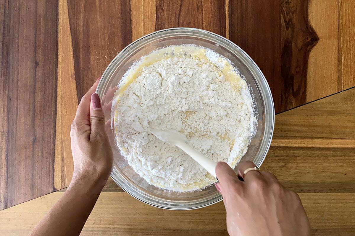 Flour mixed into dough to make easy gluten free cinnamon rolls.