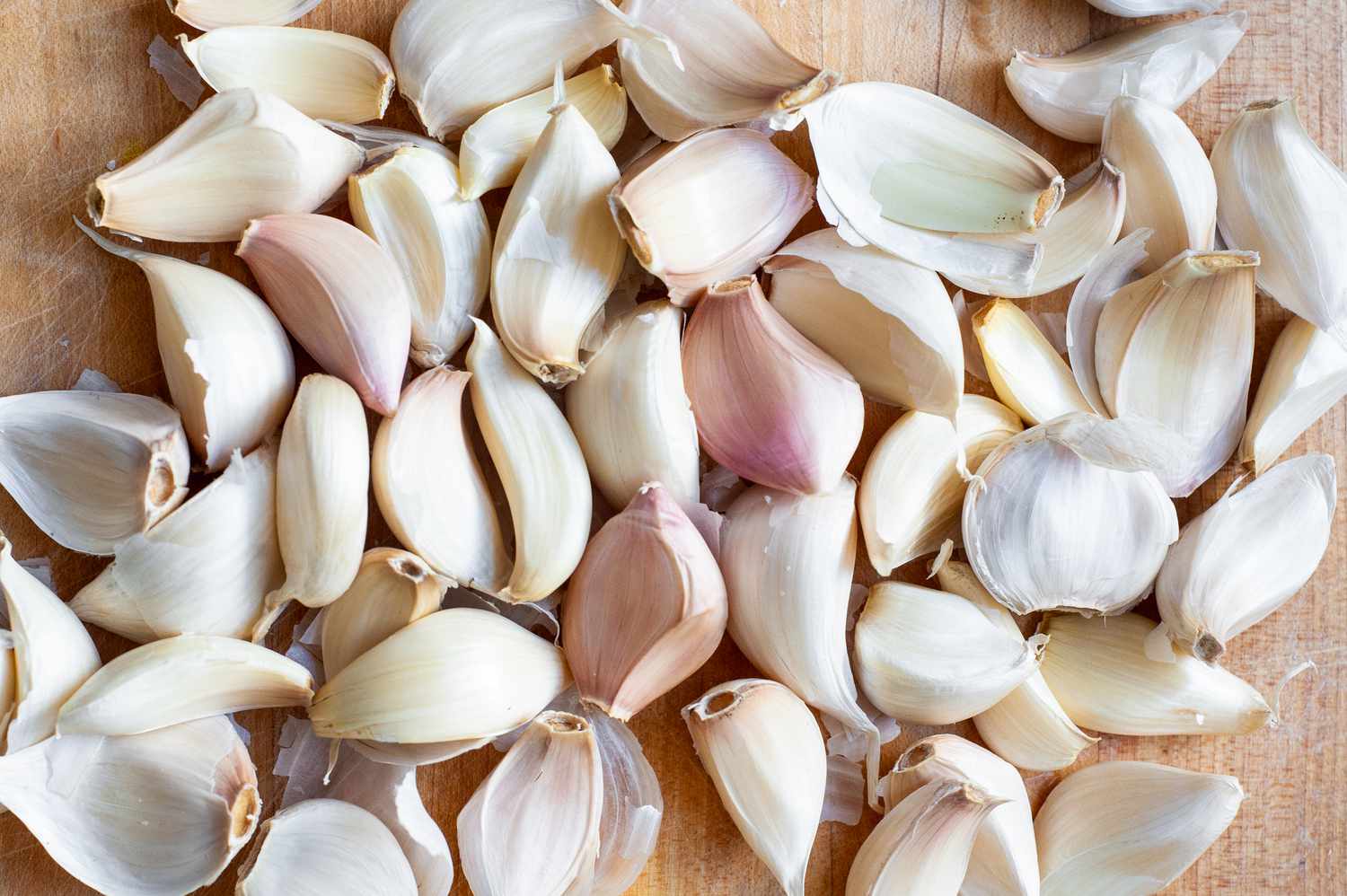 Garlic Cloves on a Cutting Board for Pickled Garlic Recipe
