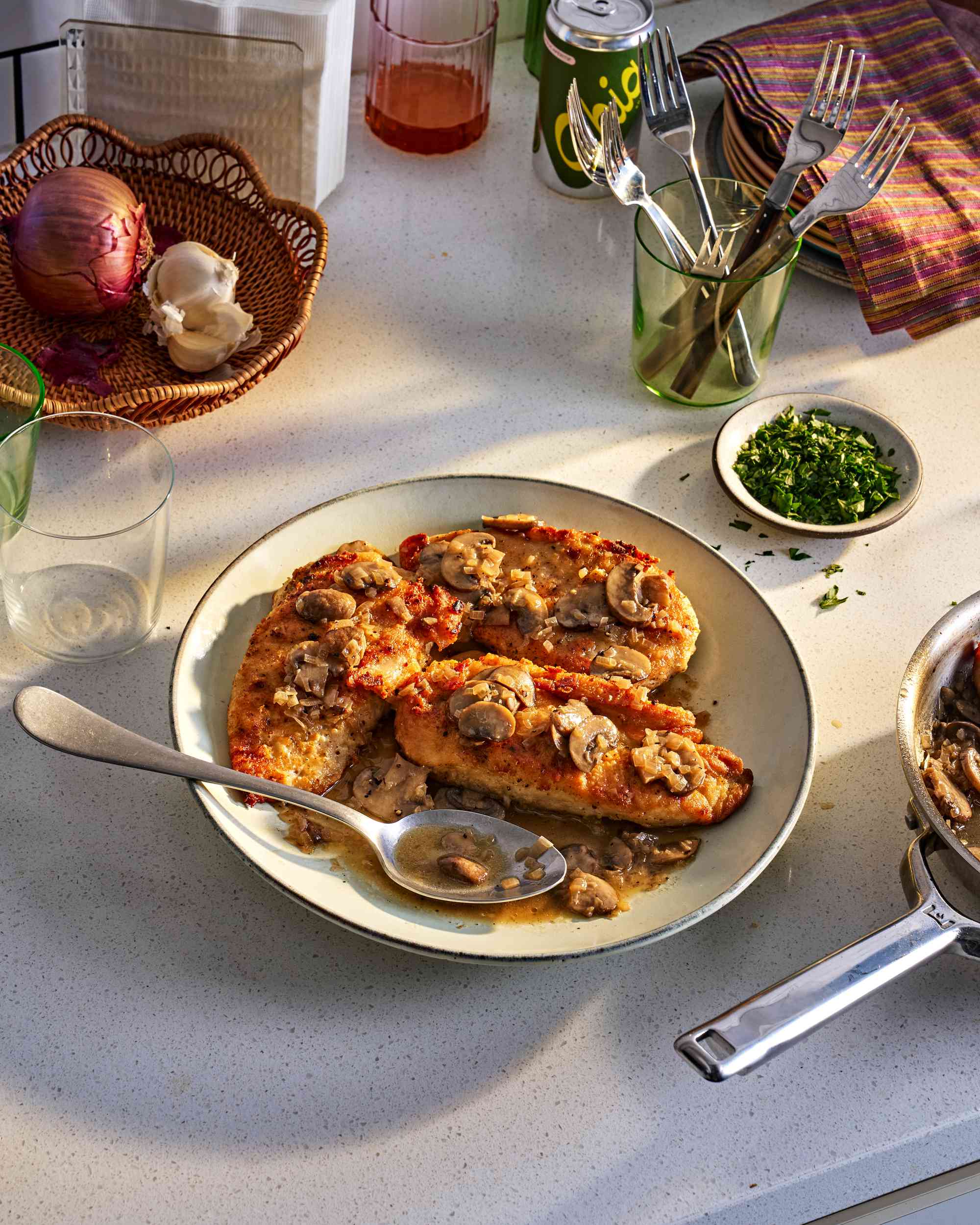 Platter of chicken marsala on a kitchen counter
