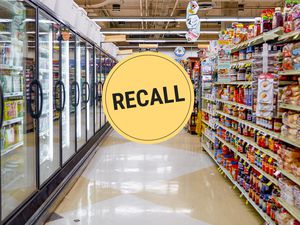 Grocery aisle with a recall graphic over top