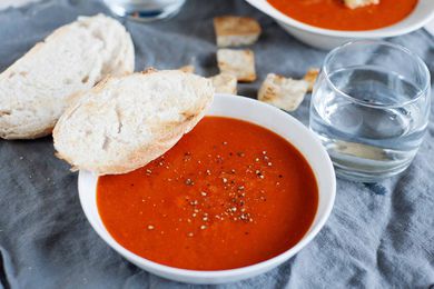 Best Tomato Soup Recipe - bowls of tomato soup on table with bread