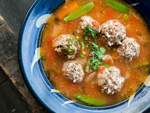 Albondigas Soup (Mexican Meatball Soup) in a blue bowl