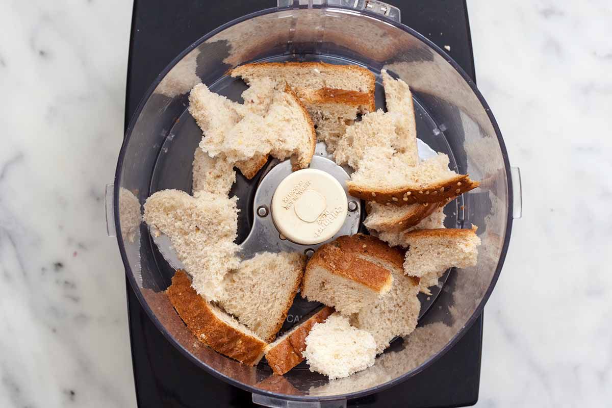 Tear the bread for Turkey Meatloaf into pieces and add to a food processor