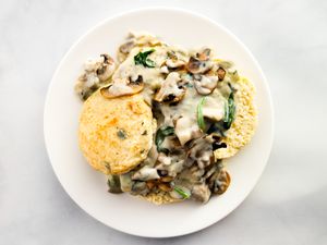 Vegetarian biscuits and gravy on a white plate.