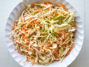 Pickle slaw with cabbage, carrots, and pickle juice in a bowl