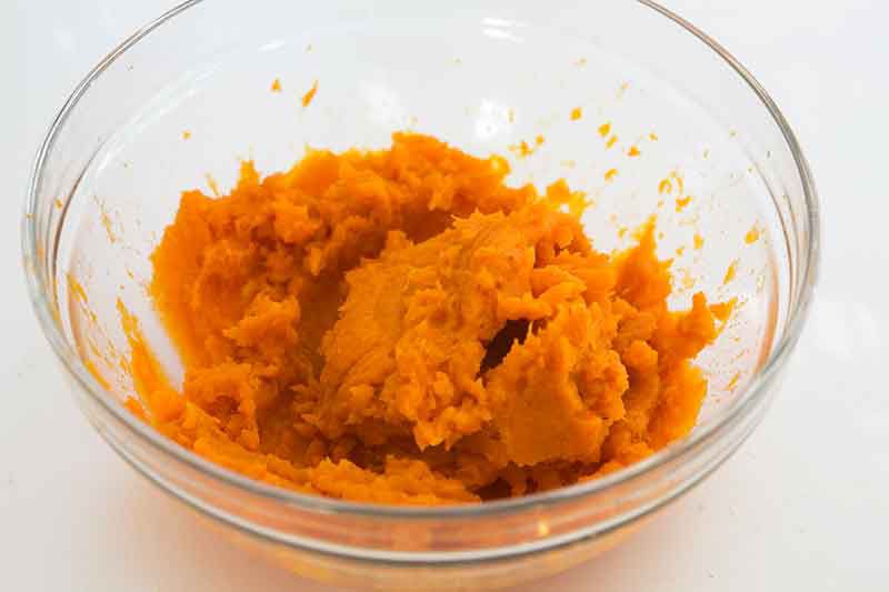 mashing sweet potatoes for pie filling
