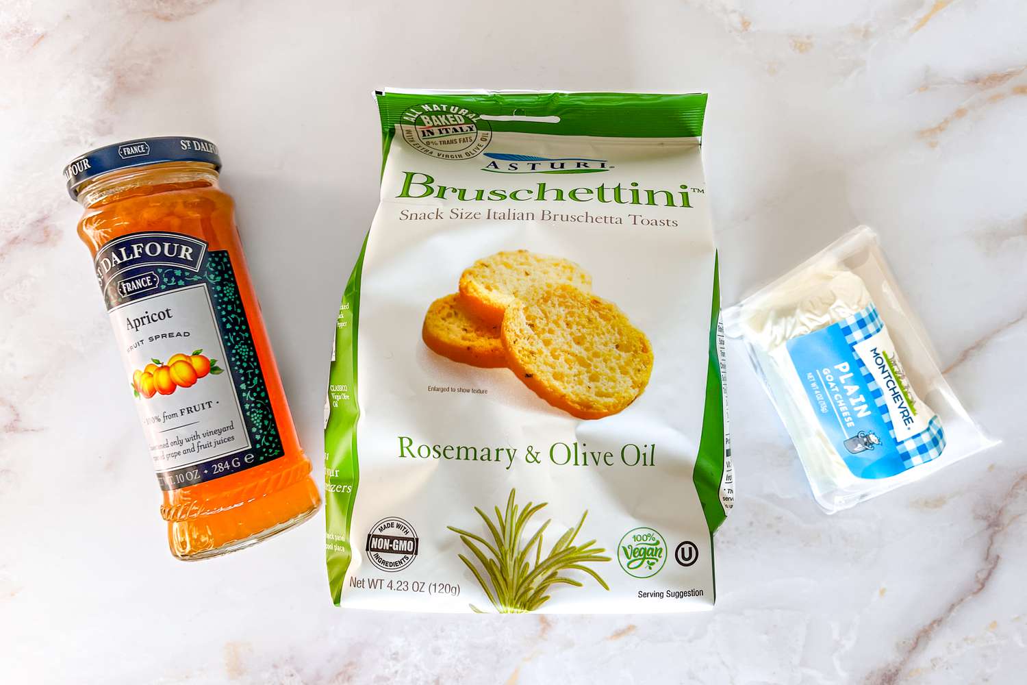 goat cheese crostini ingredients (apricot jam, bruschettini, and goat cheese)