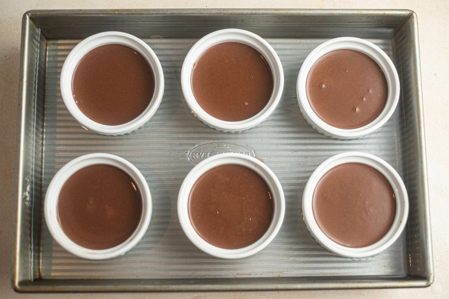 Tray of Chocolate Pots de Crème in Ramekins Surrounded by Water