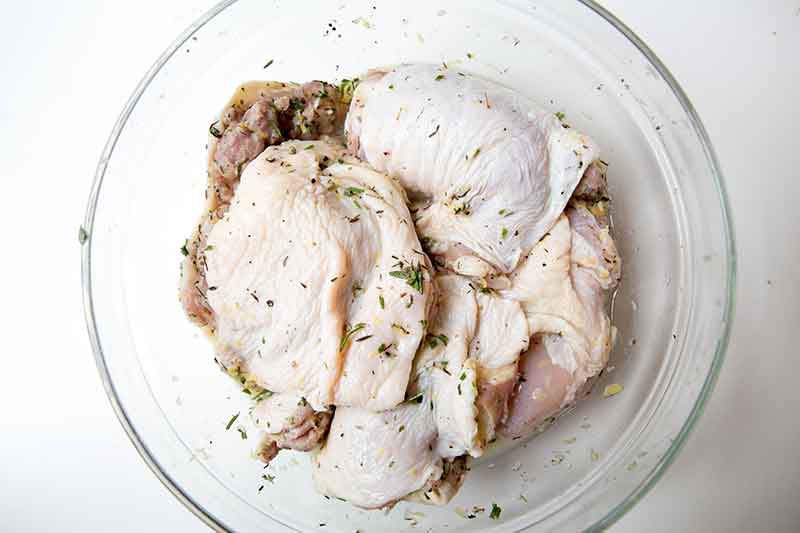 Raw Chicken Marinated and Zested With Lemon