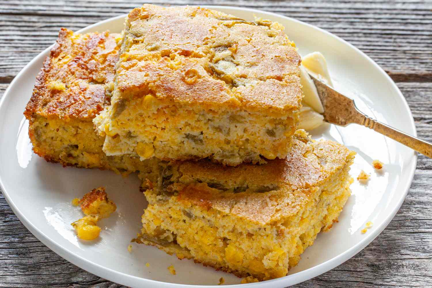 Pieces of Corn Bread Recipe on Plate with Butter
