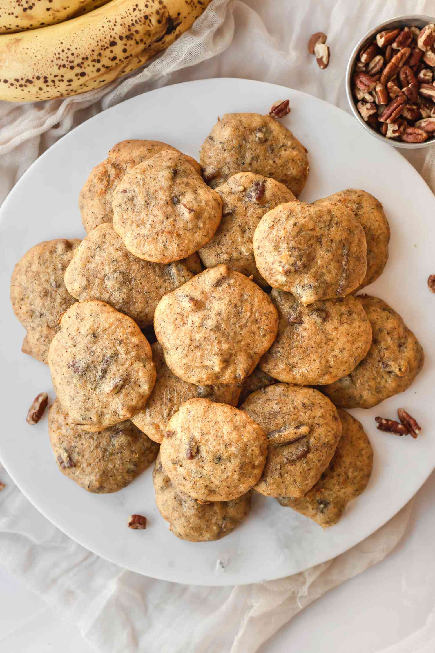 Overhead view of a plate of banana cookies.