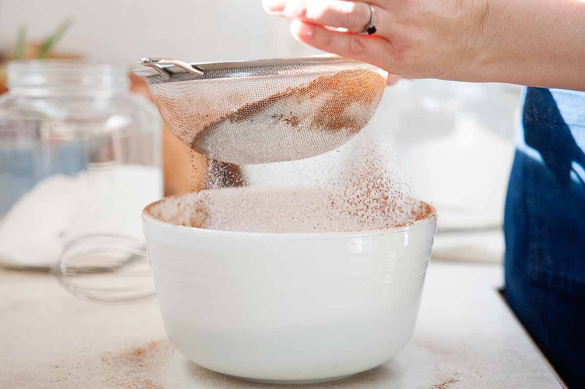 Chocolate Sour Cream Cake with Fudge Frosting - sifting the flour