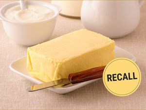 Stick of butter on a plate with a knife, "Recall" label placed over the image.