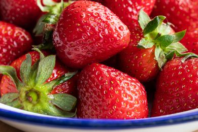 close up of strawberries in a bowl