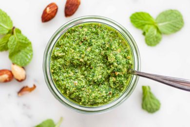Mint and Almond Pesto - jar of mint pesto on white counter