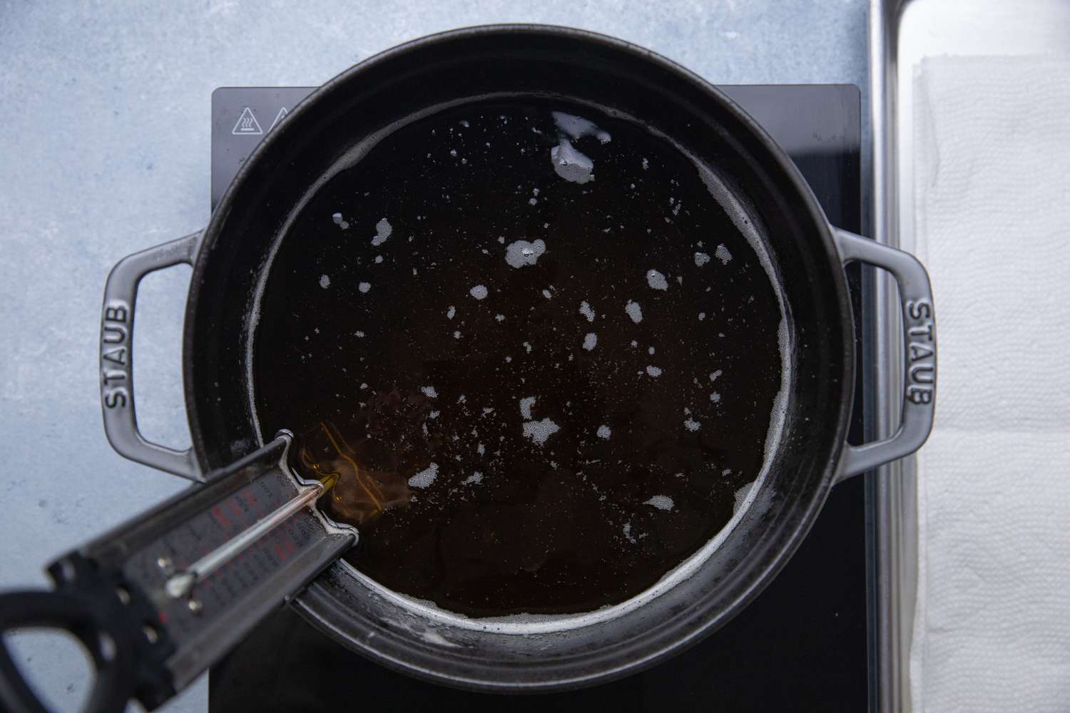 Pot of Oil with a Frying Thermometer for NOLA Po' Boy Recipe 