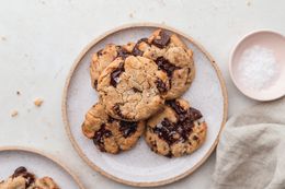 Quick and easy vegan chocolate chip cookies stacked on a plate.