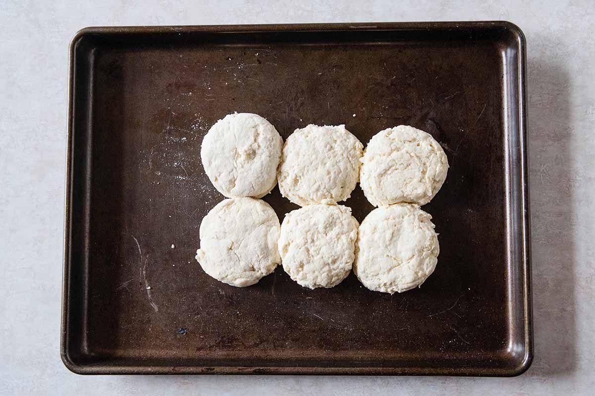 Homemade Biscuit Recipe - baking sheet with six biscuits on it