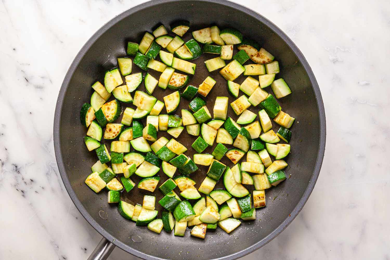 Cubed Zucchini Cooked in a Skillet for Ratatouille Recipe