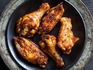 A plate of gilled BBQ chicken wings