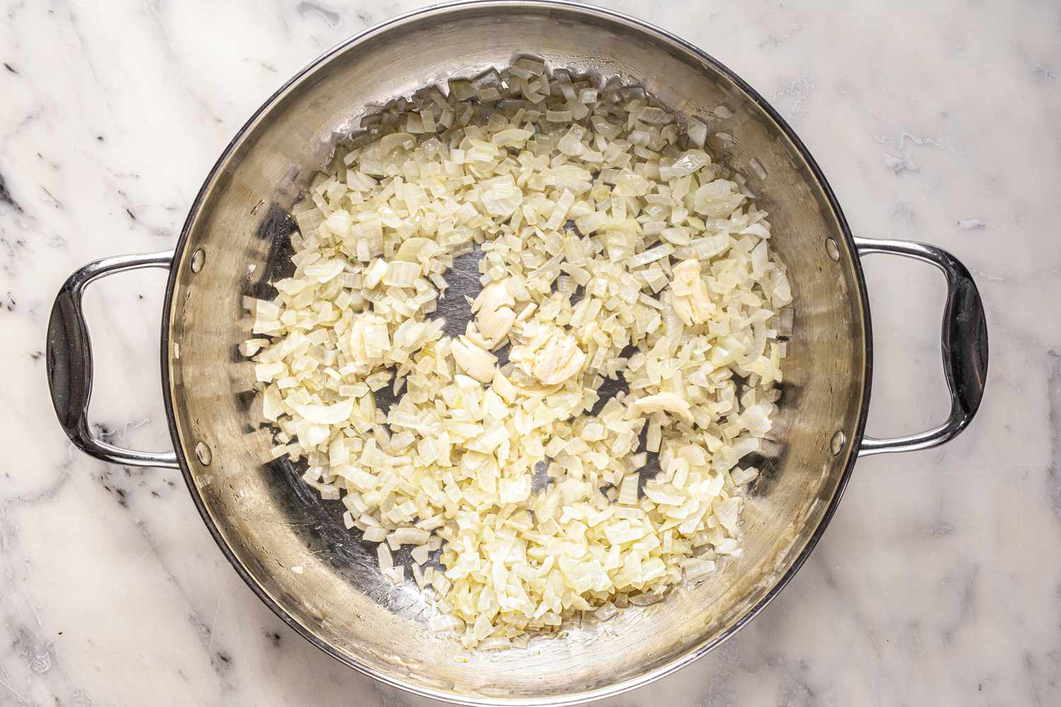 Diced Onions Cooked in a Pan for Classic Ratatouille Recipe