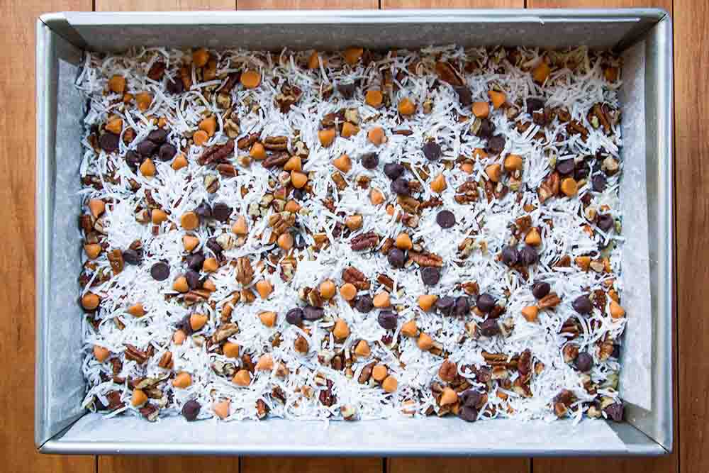 A last layer of shredded coconut sprinkled over the top of the magic cookie bars
