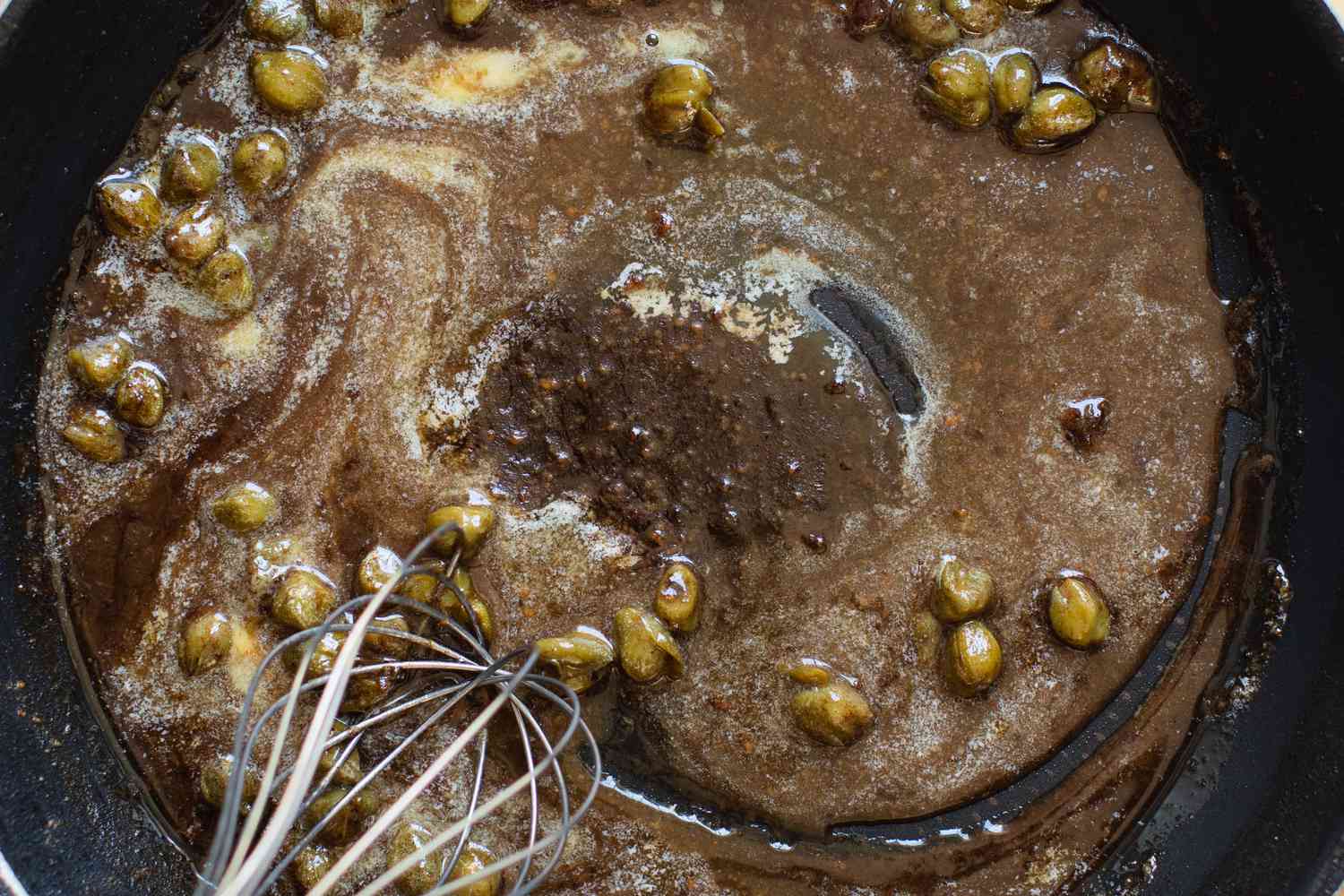 Whisking Capers and Melted Butter Together in Pan for Piccata