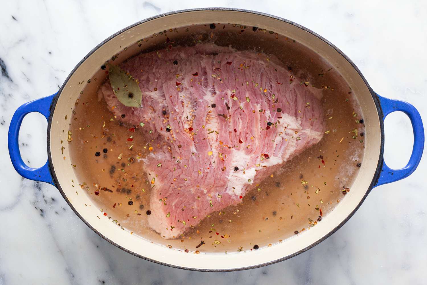 corned beef in a pot to make New England Boiled Dinner