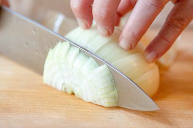Knife Cutting Onion Cross-wise for How to Chop an Onion