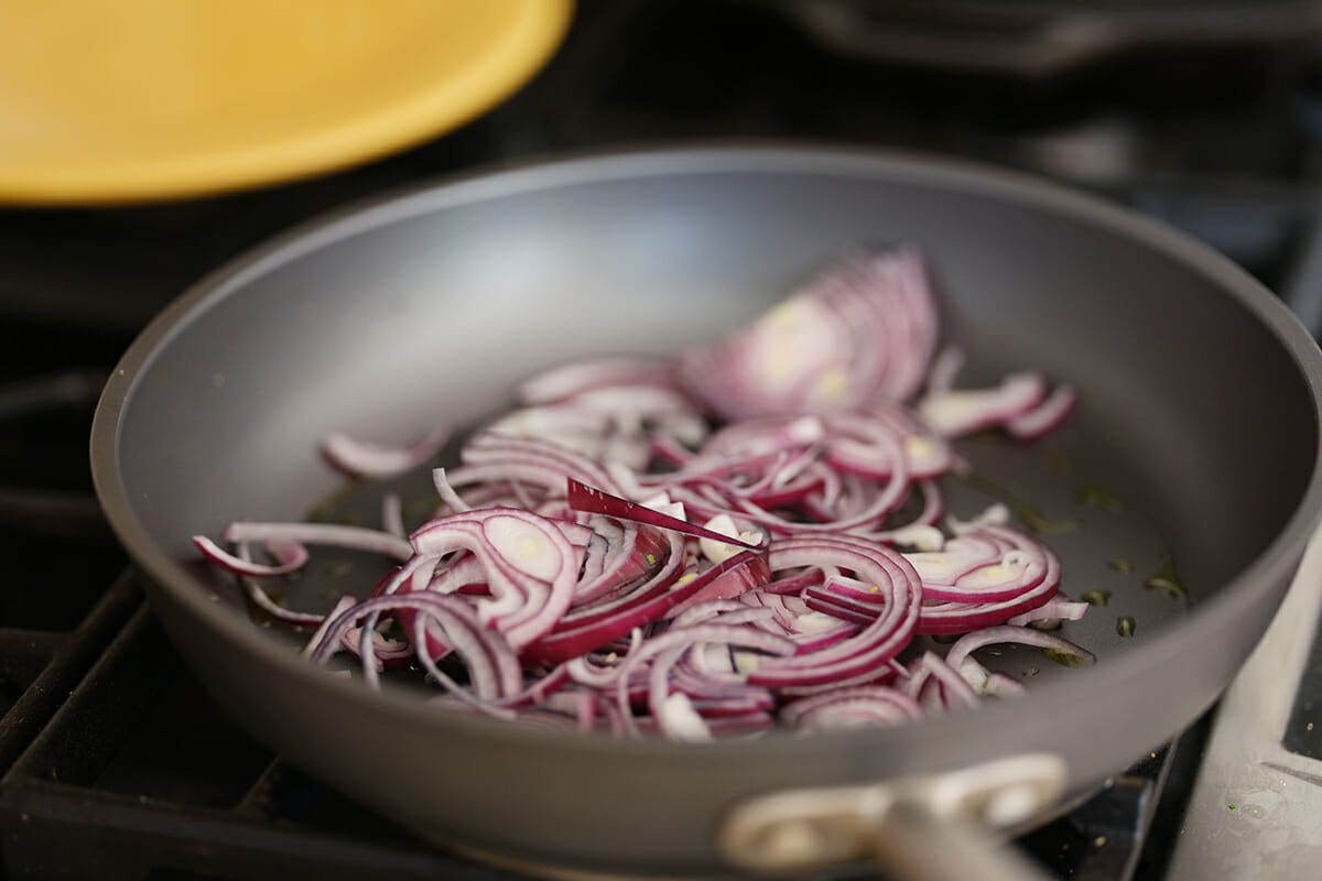Avocado black bean quesadillas cook the red onion
