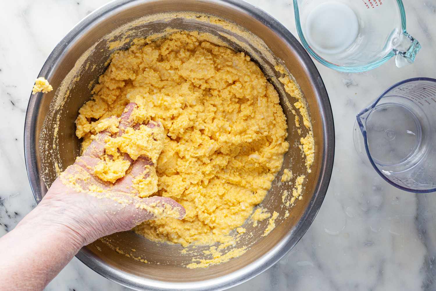 Arepa dough will be sticky.