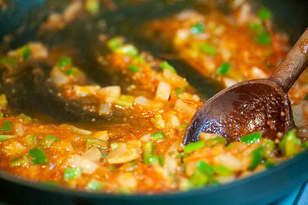 saute onions with green chiles and tomatoes