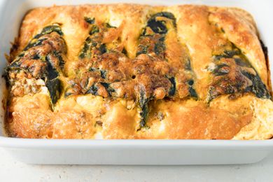 An uncut chili relleno casserole on a white background