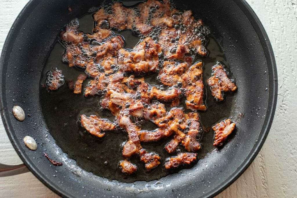 Crispy bacon in a skillet for easy potato soup