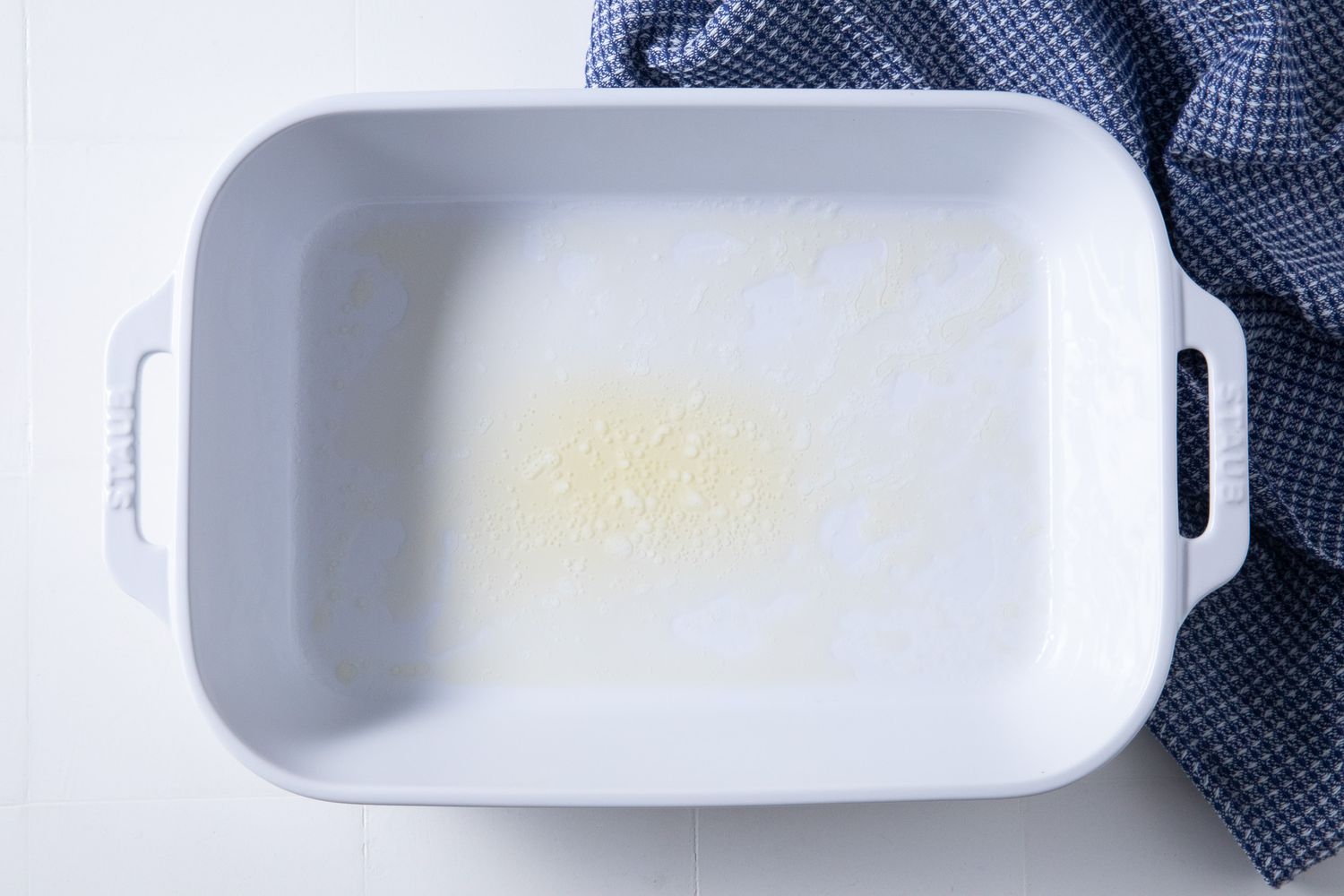 melted butter in a casserole dish for batsaria recipe
