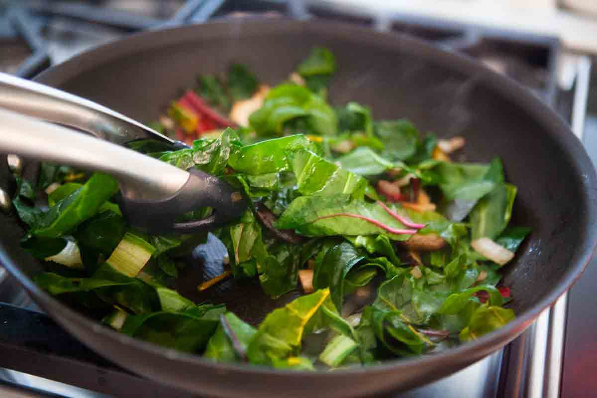 swiss chard tongs in pan