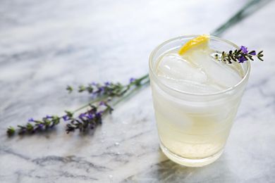 Lavender Lemonade on a small glass garnished with fresh lavender