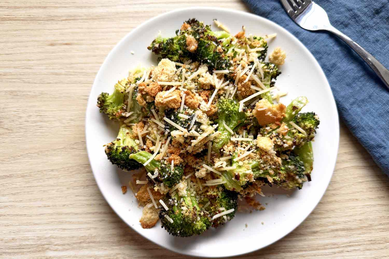 Overhead shot of a plate with a serving of prepared Trader Joe's Caesar broccoli bake kit