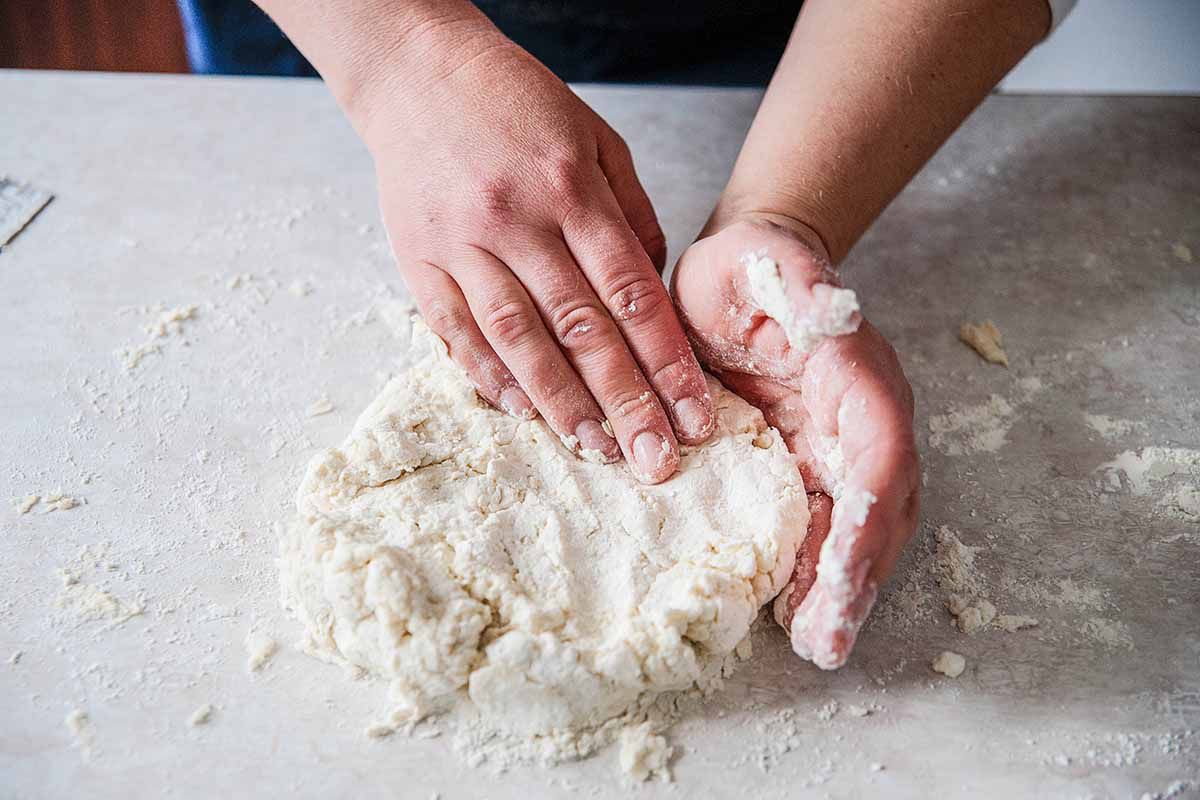 Buttermilk Biscuits Recipe - woman forming dough wtih hands