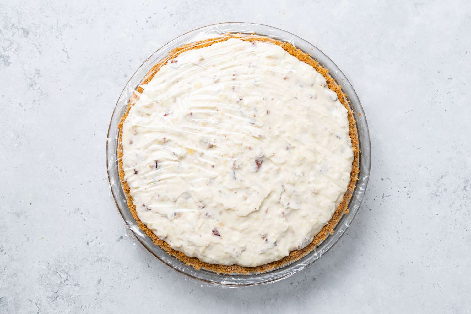Pie Dish With Million Dollar Pie Covered in Plastic Wrap