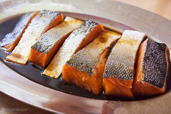 marinated salmon on plate before grilling