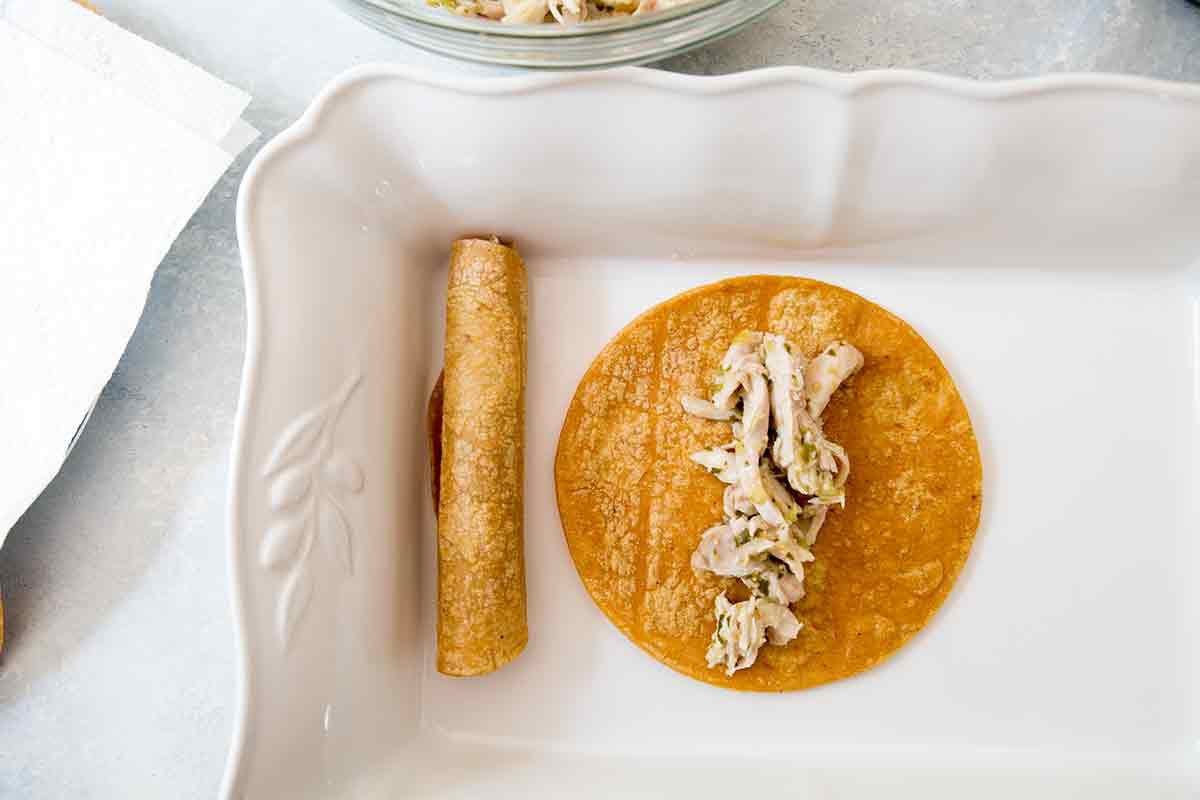 Shredded Chicken with Salsa Verde sauce placed on cooked Tortilla 