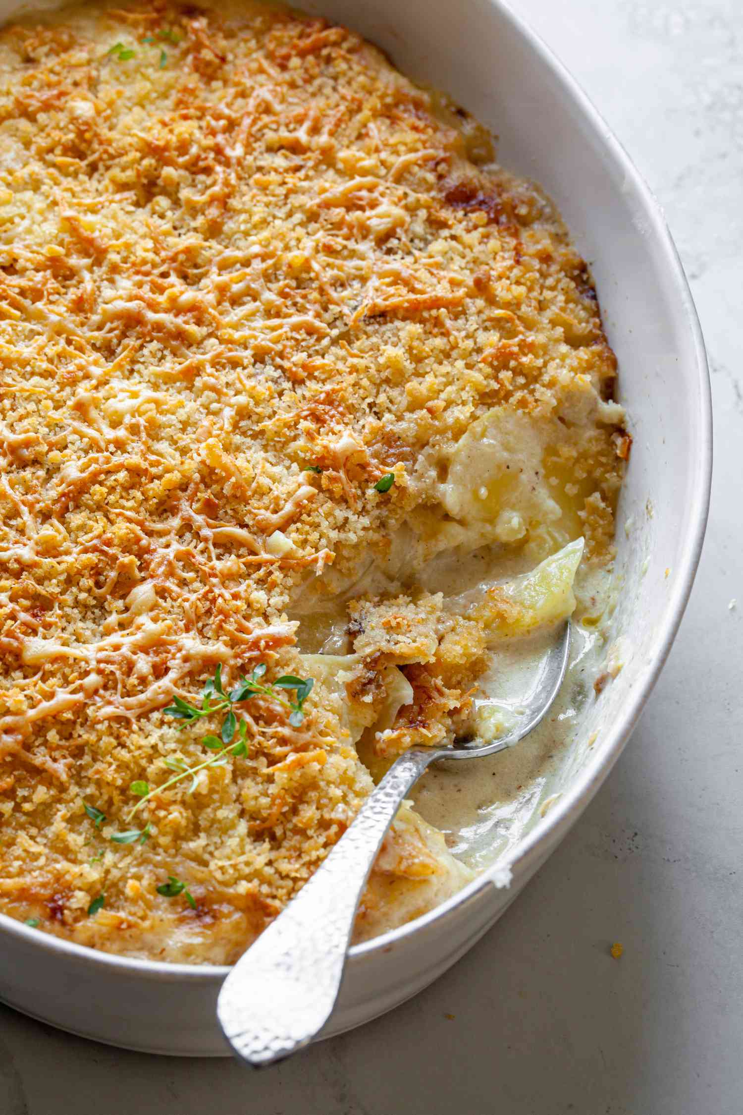 Potatoes Au Gratin in a Casserole Dish with Some Missing