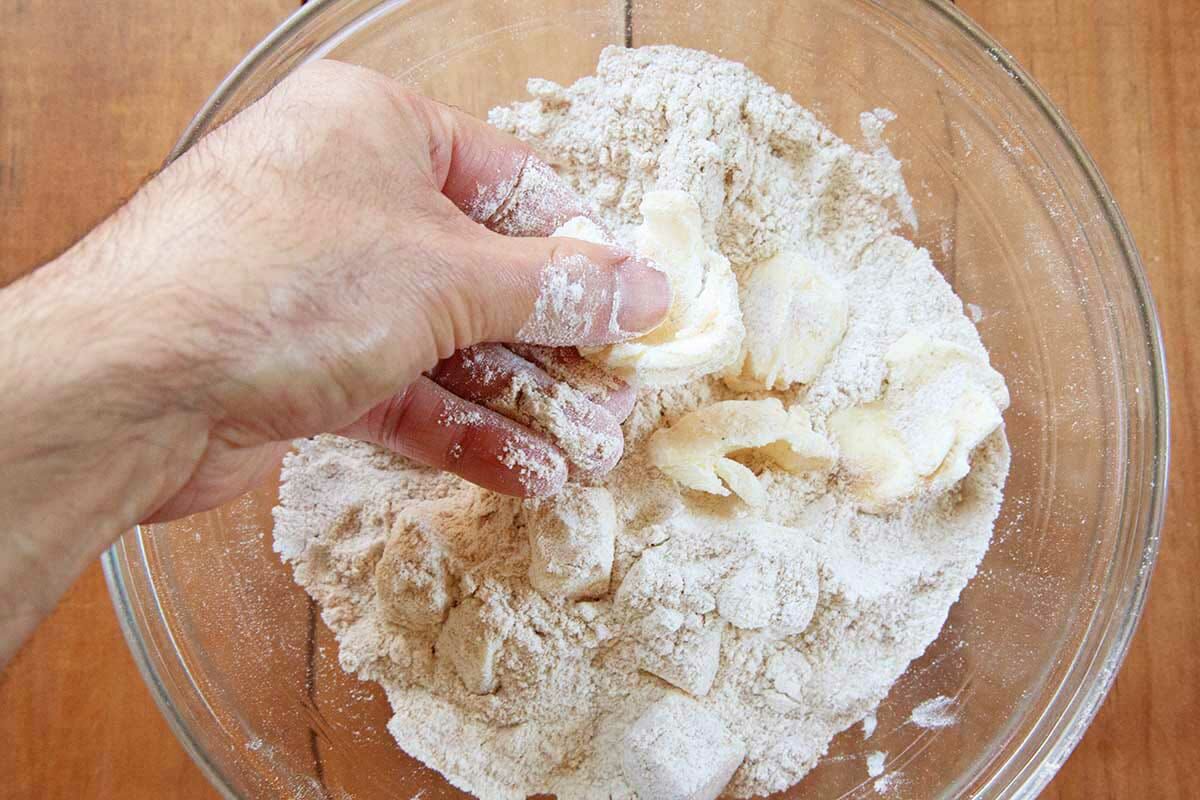 Butter pressed into flour to show how to make pie dough for the best shoofly pie.